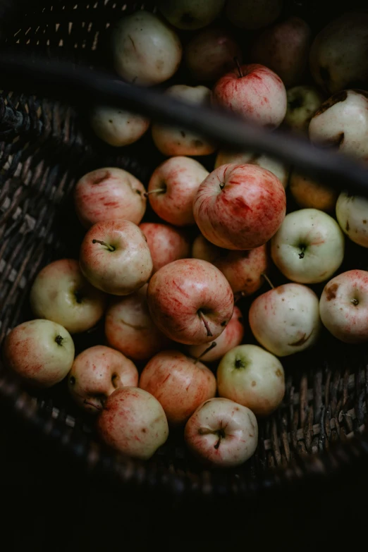 an assortment of apples is in a basket