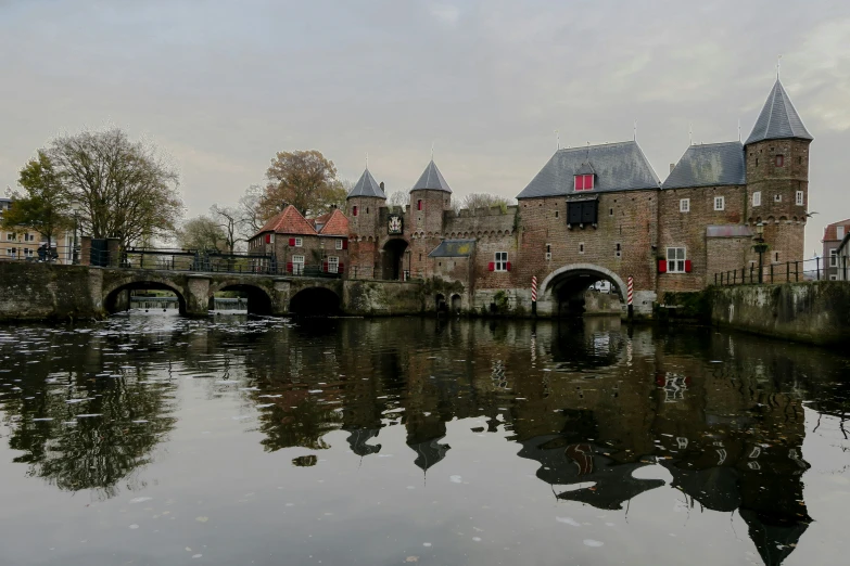 a castle in the distance and a bridge across a canal