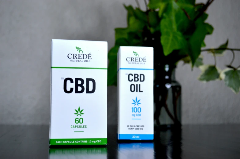 two boxes of cbd oil are side by side