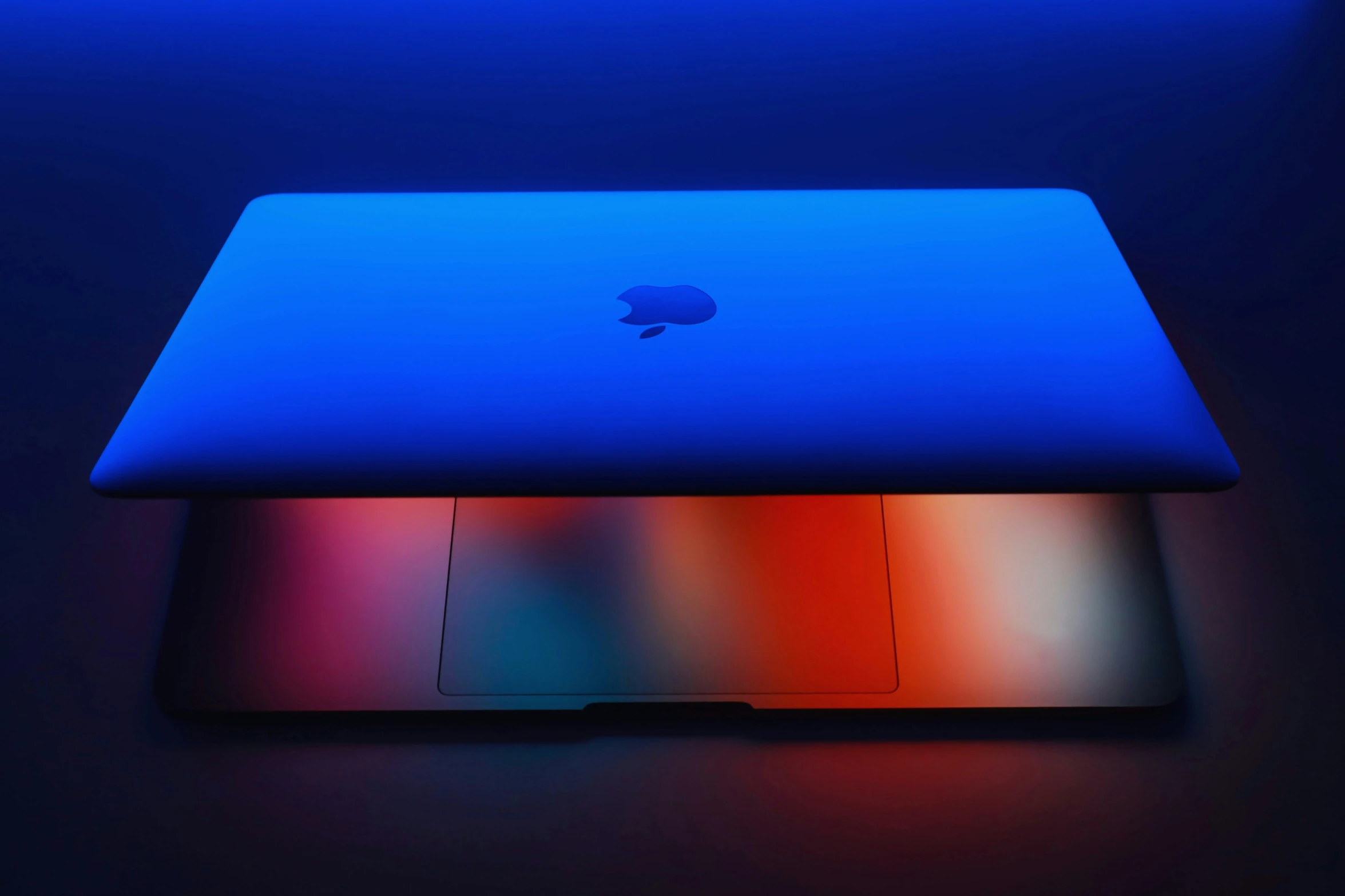 a apple mac laptop in a brightly lit room