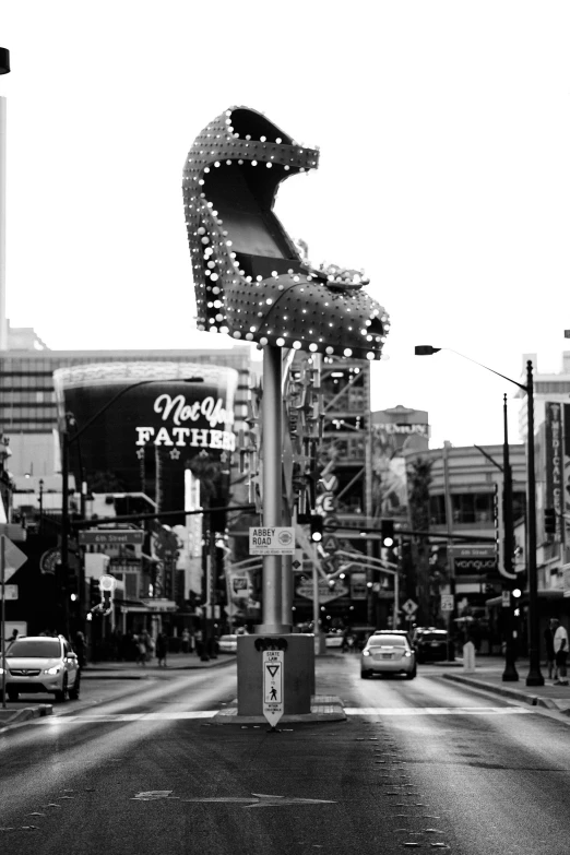 a city street has a large sculpture of a bear on it