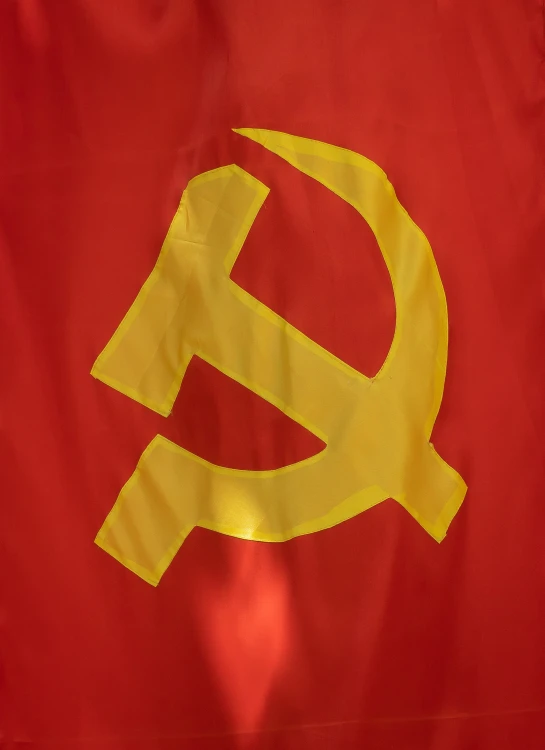 a red and yellow flag with gold logo