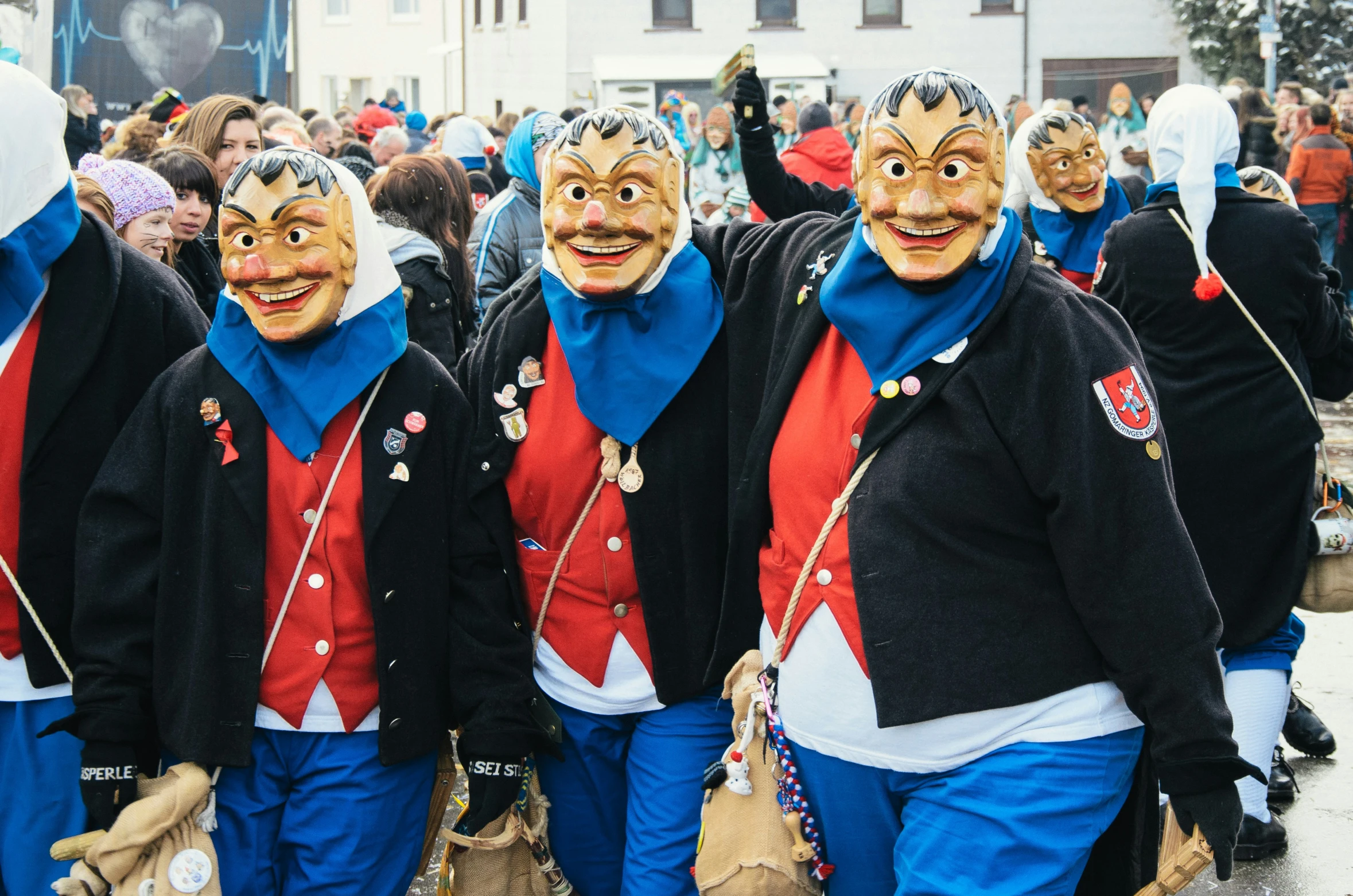 two row of men wearing red and blue costumes