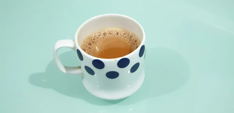 a coffee cup sitting on top of a table