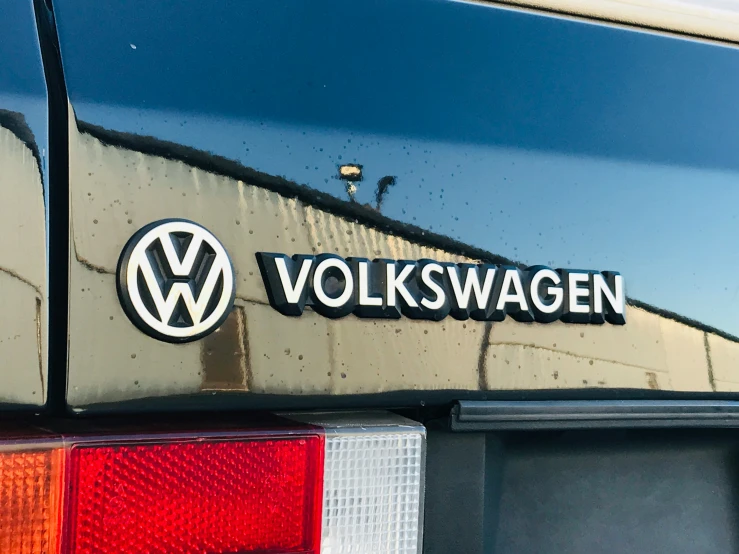 volkswagen is seen closeup on the tail end of a car