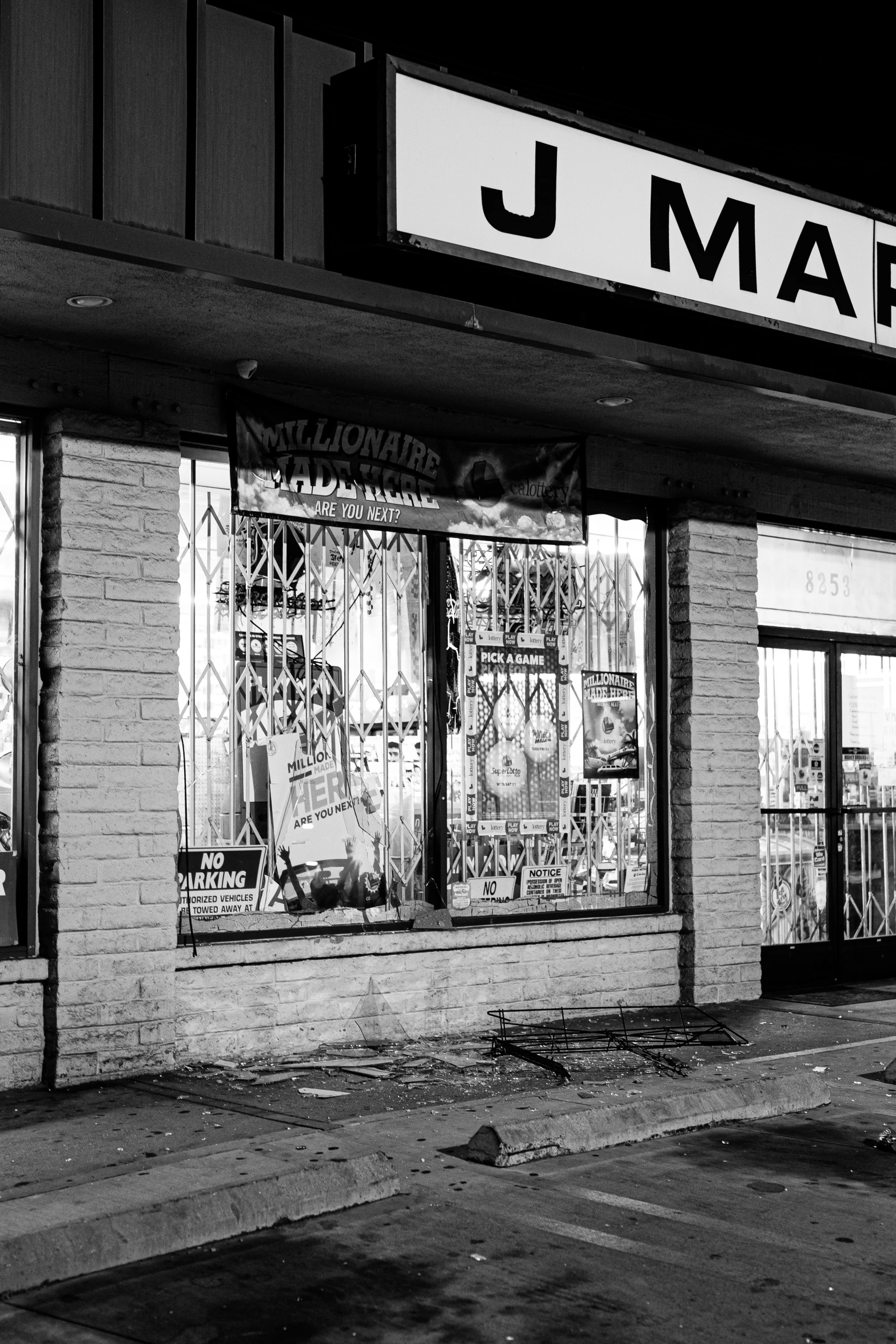 a store front with closed windows at night