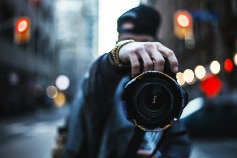 a person is holding up a camera to take the picture