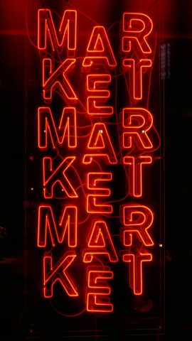 a neon sign that says market market ketchup