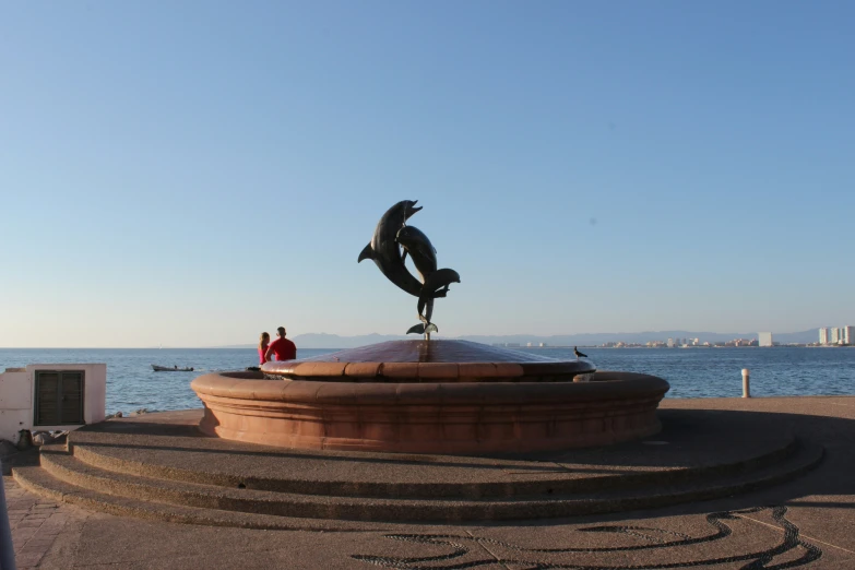 a statue of an eagle sitting on top of a table