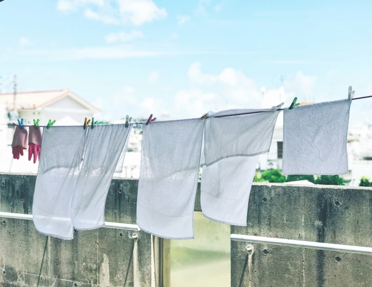 a group of clothes hanging from clothes lines