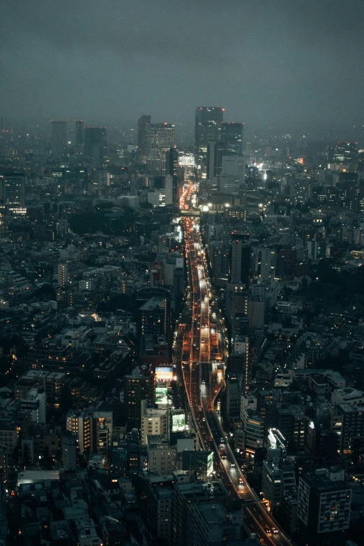 a night time po of an elevated city with a lot of traffic