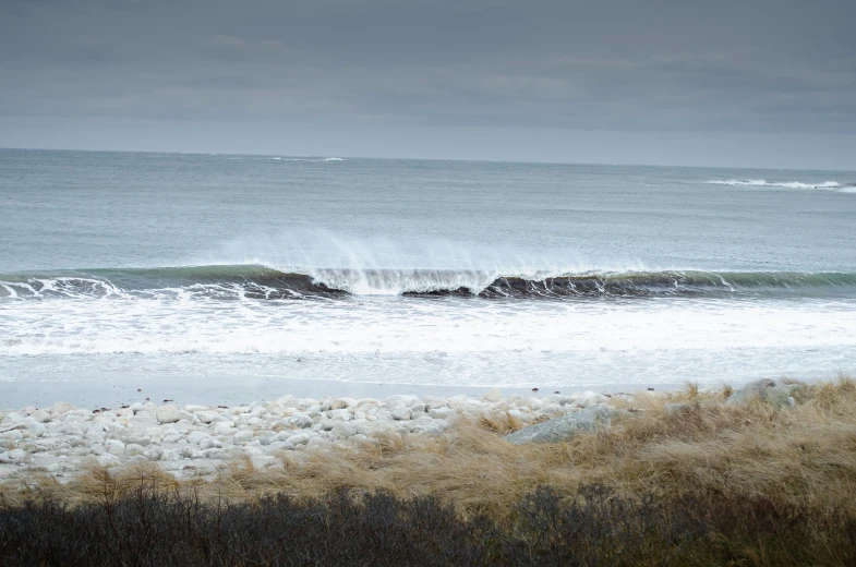 the ocean is white and hazy as it comes toward the shore