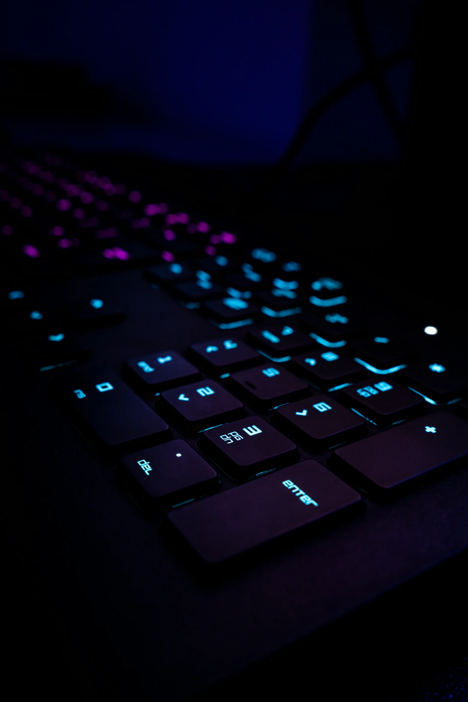 glowing black keyboard in the dark on a table