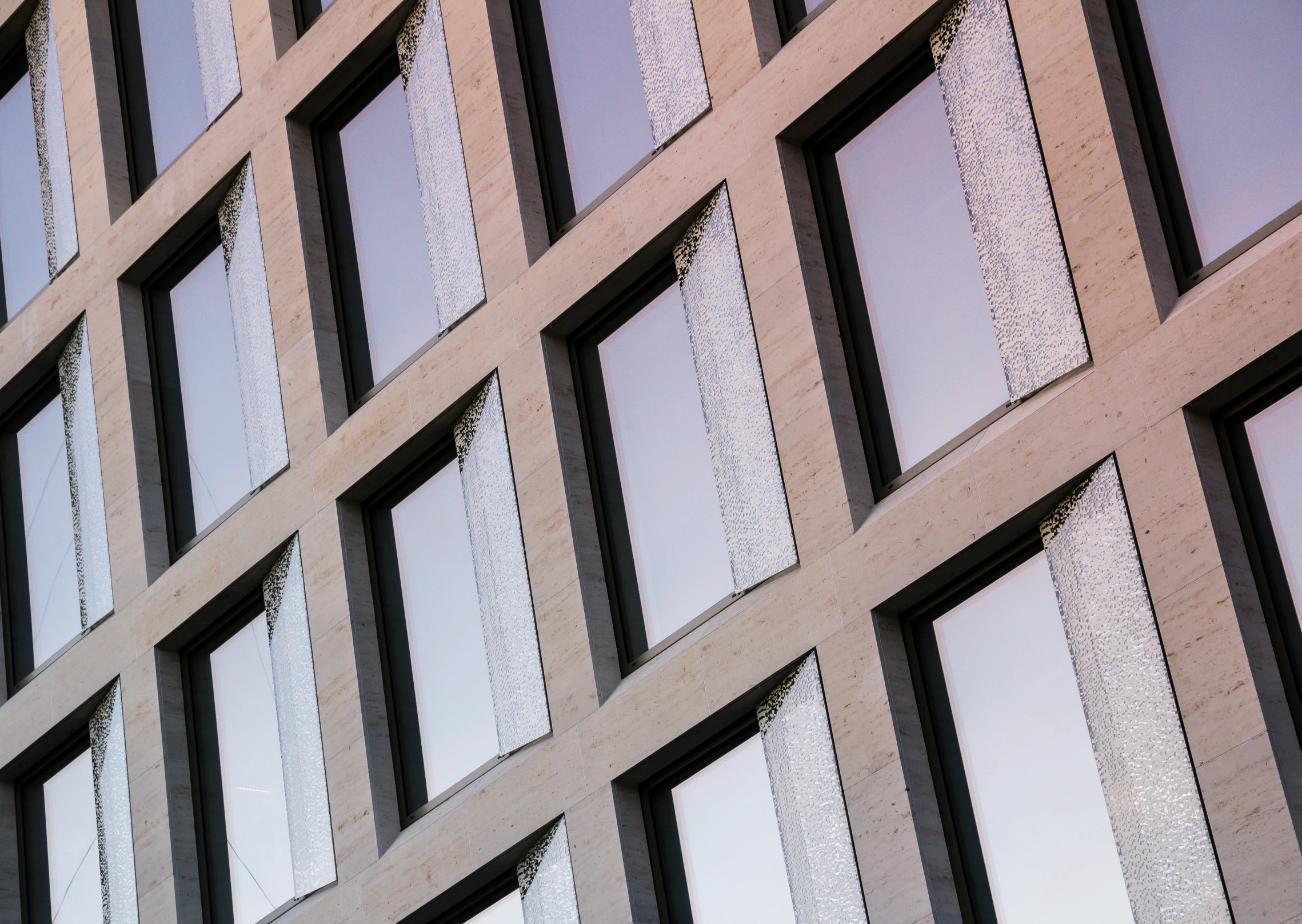 view of a modern, empty office building with window glass