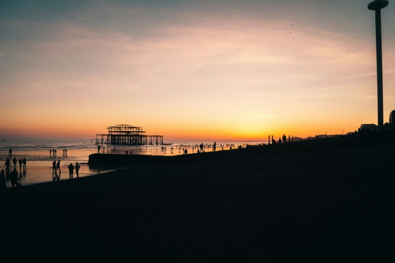 the sun sets at an empty beach