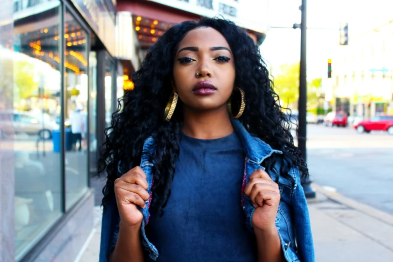 a woman with long hair is looking away from the camera