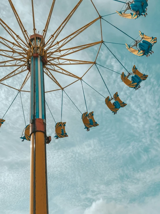 a carnival ride with many blue and yellow rides