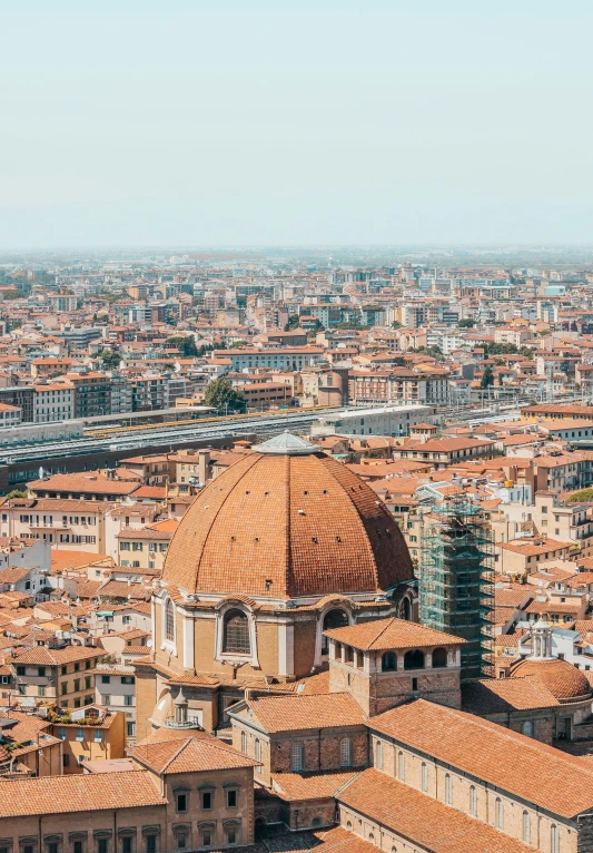 a city is shown with a cathedral and rooftops