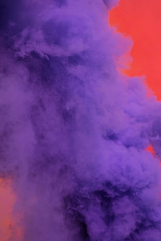 a red and purple background with clouds of smoke