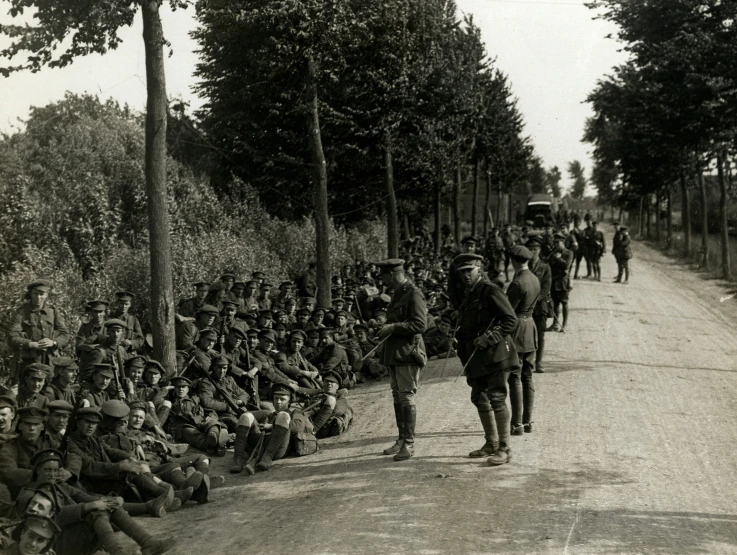 an old po of soldiers standing on a road