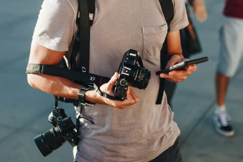 man holding camera, phone, camera and running exercise