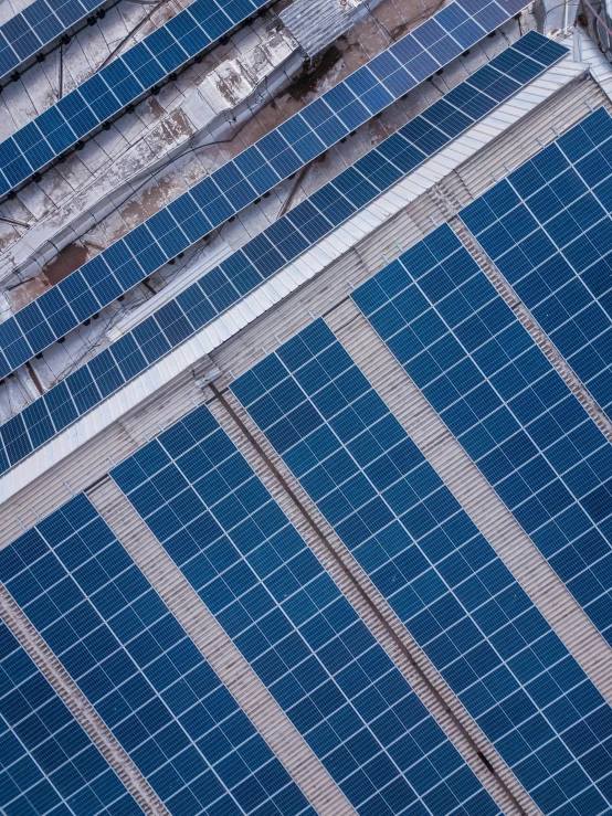 this po shows the top part of an overhead view of a building, looking down on a solar - powered airplane