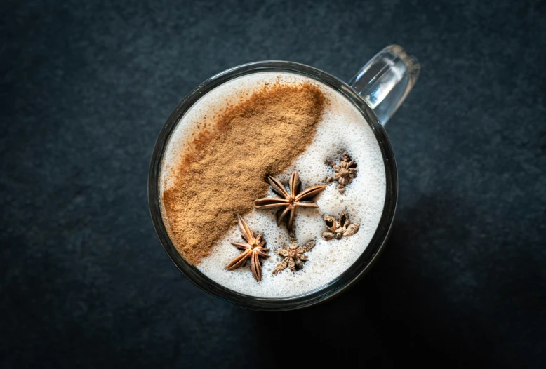 spice and cinnamon spiced  drink in a glass cup