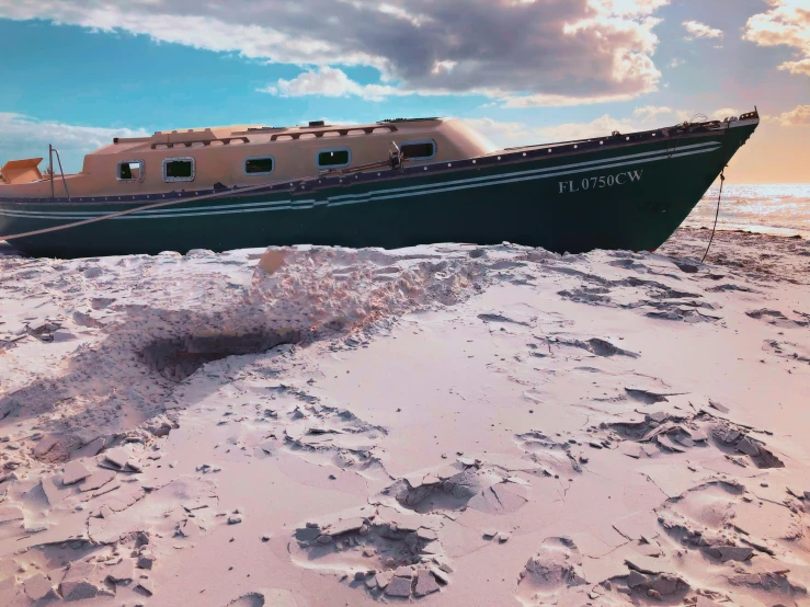 a large brown boat in the sand at the beach