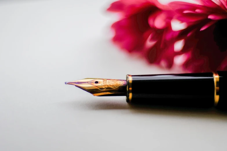 a fountain pen resting on a table