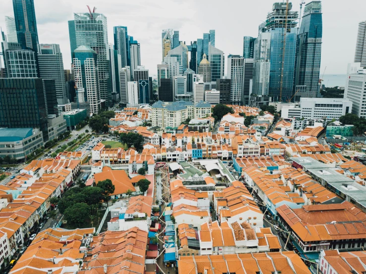 an aerial view of some houses on a city street