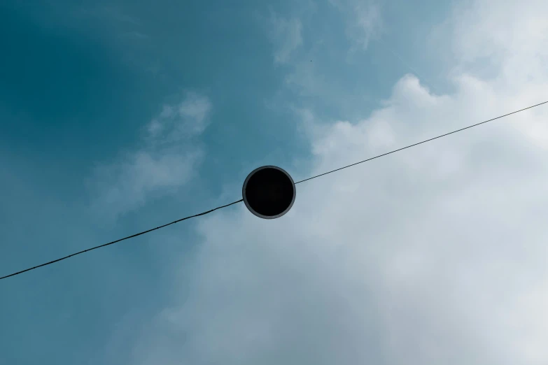 a circular thing on a wire is shown in the air