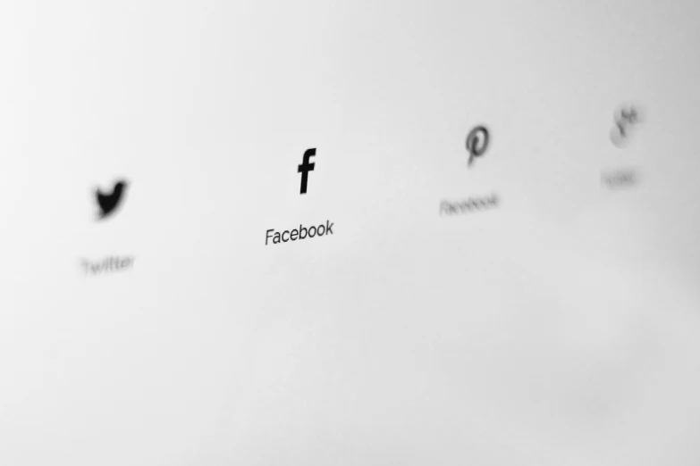 a white wall with a facebook logo on it