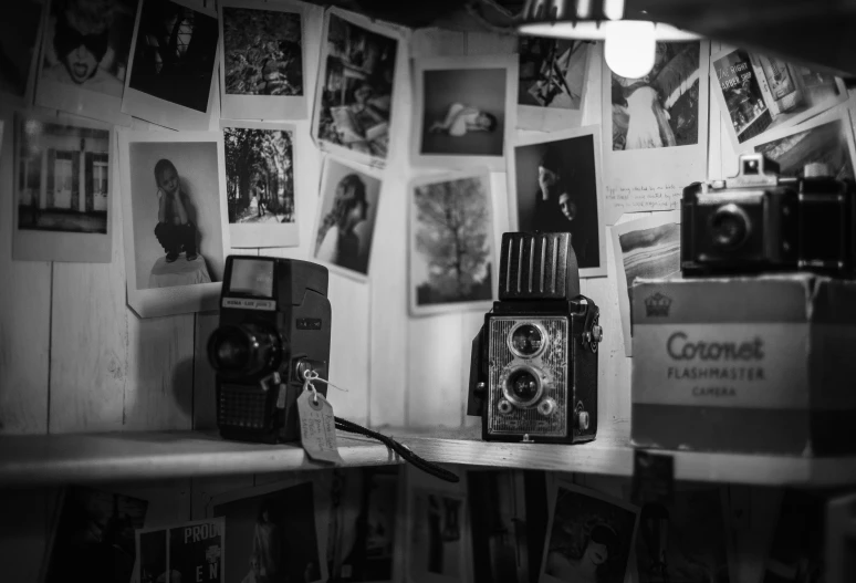 an old fashioned camera on a shelf in a small room