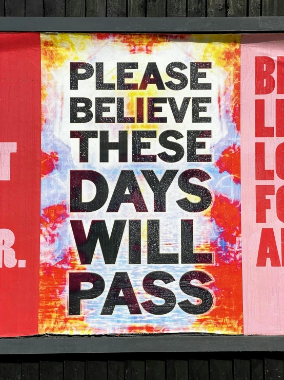 a colorful sign that reads please believe these days will pass