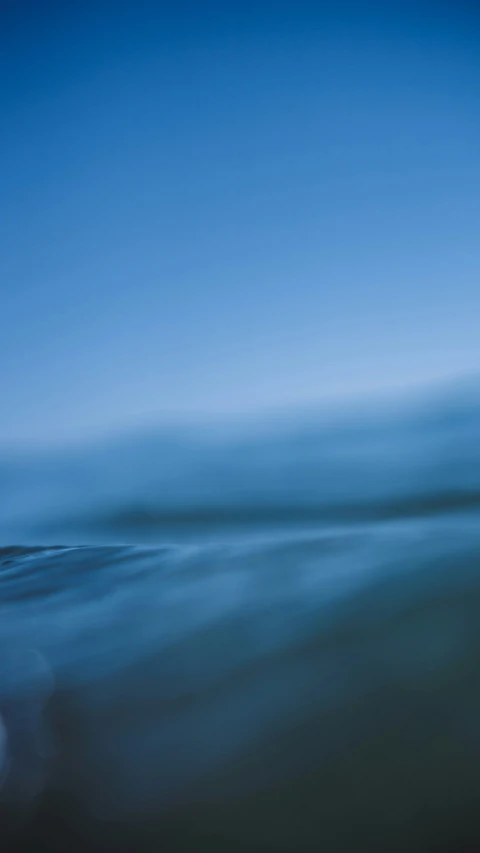 the ocean water is crystal blue and looks like it could be an abstract painting