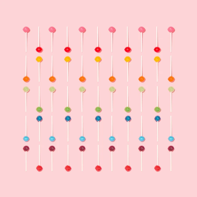 an art print of multi colored candies on a stick