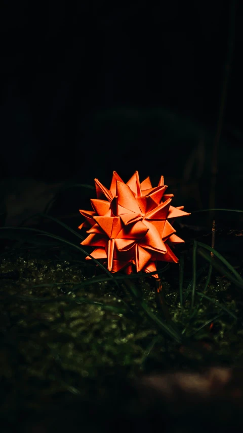 a big orange object standing in the dark