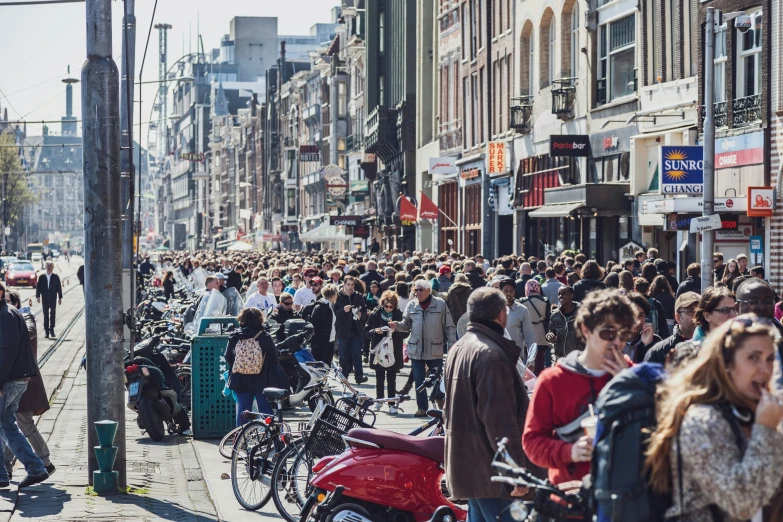 a crowded city street has many people on it