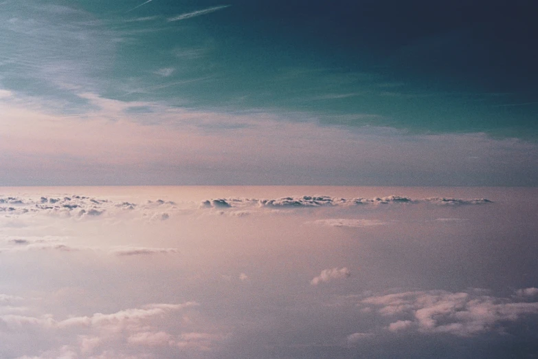 an aerial view of a group of clouds and a sky