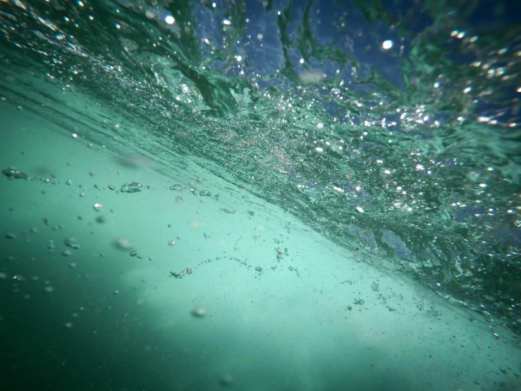 some bubbles are floating on the water surface