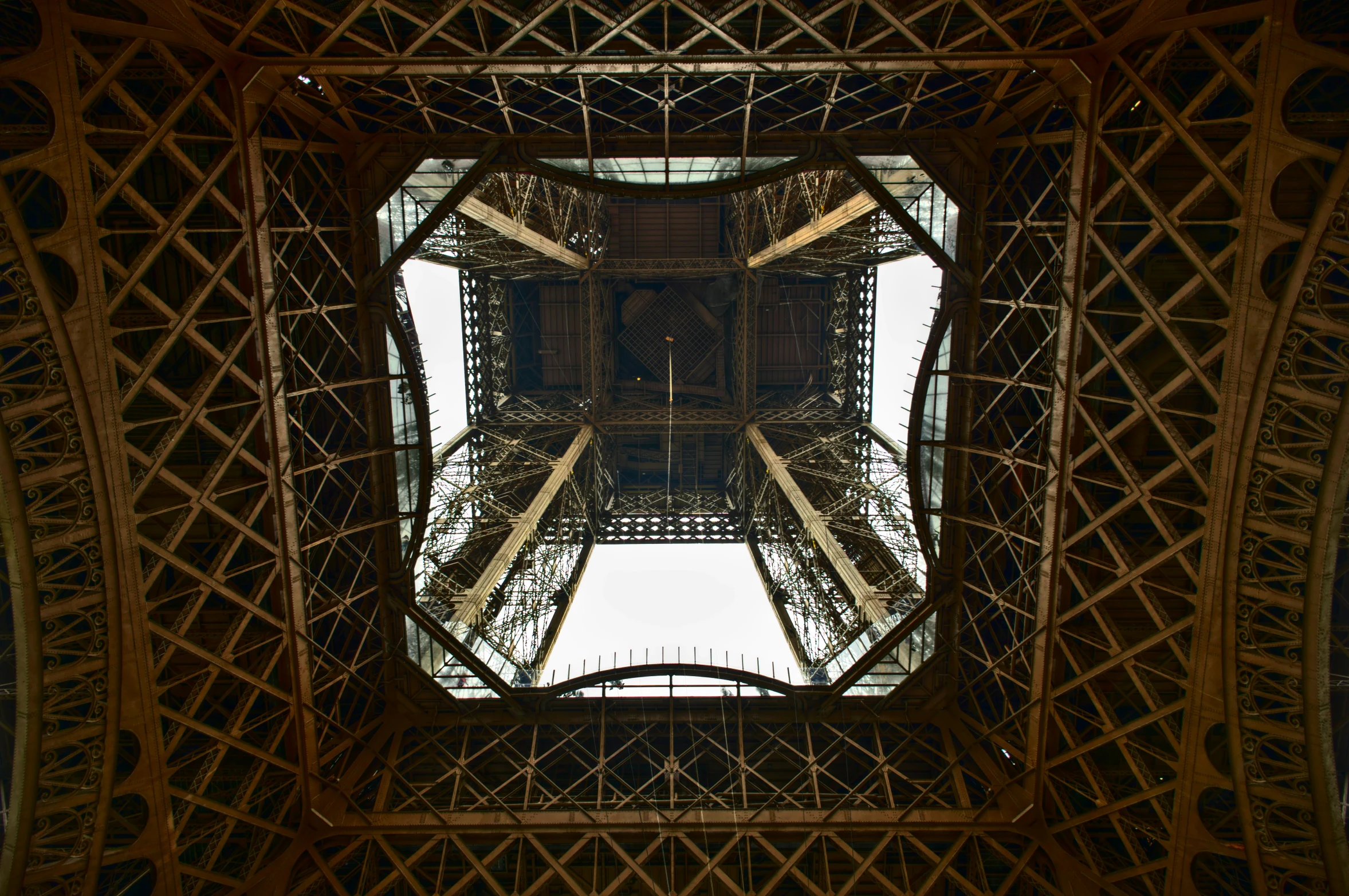 looking up at the top part of the eiffel tower