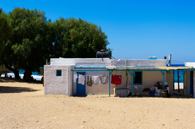 a small house that is in the sand