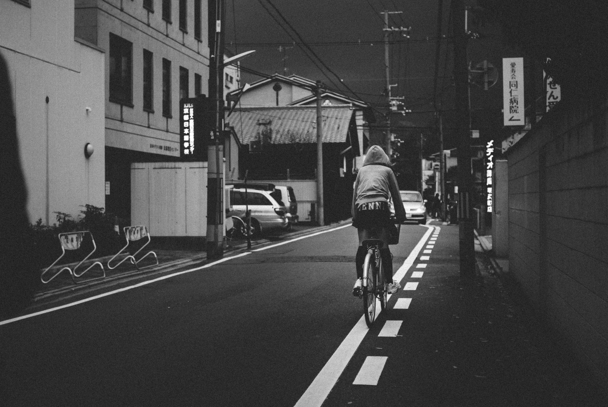 a man is riding his bike down the street