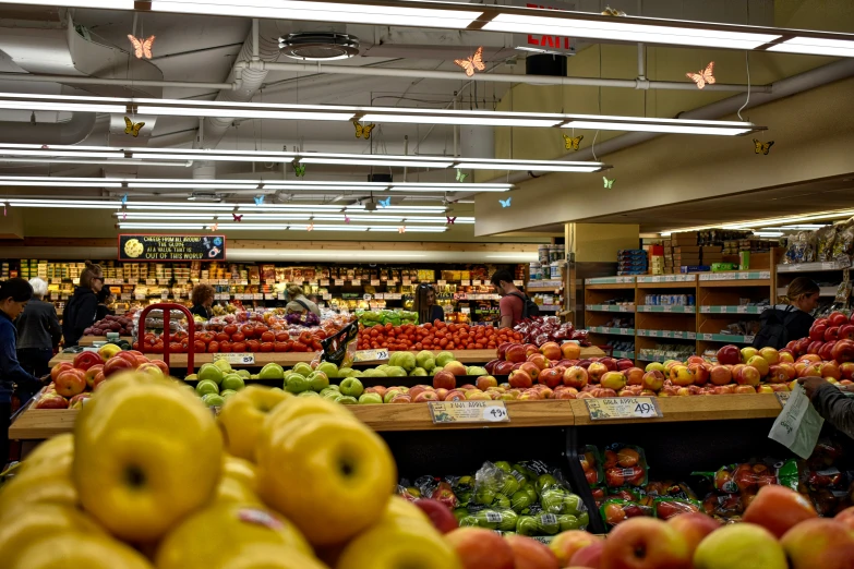 a grocery store filled with lots of fresh fruit