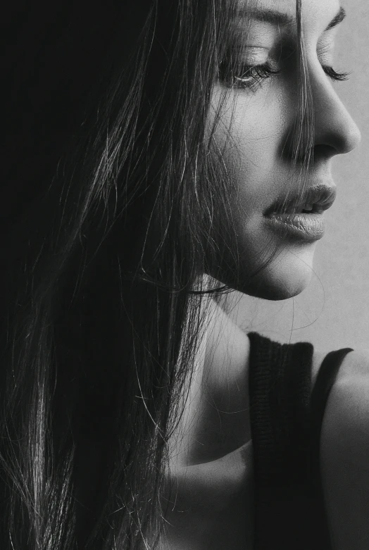 a close - up of a woman's face and neck with long hair