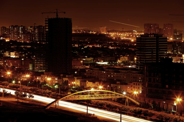 a nighttime view of the city lights and bridges