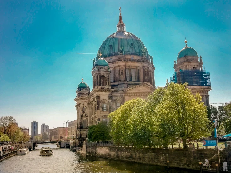 there is a large building with a dome near water