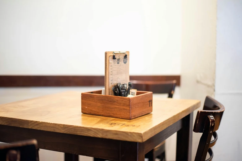 an empty box on top of a wooden table