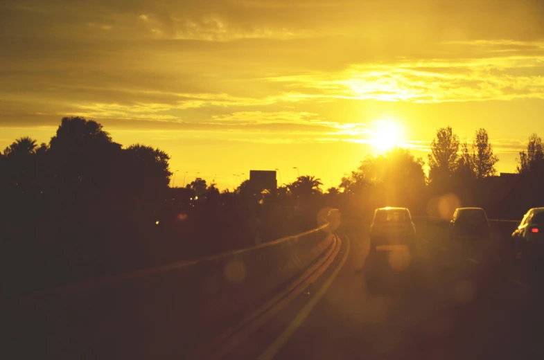 the sun sets over traffic on interstate 701