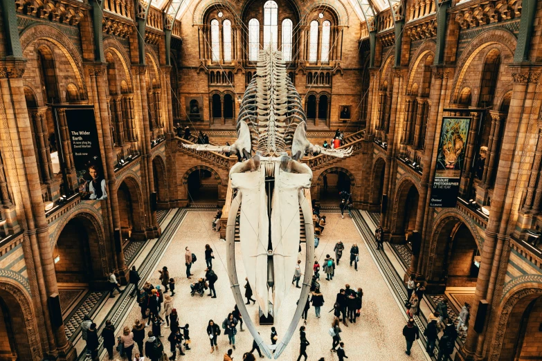 people standing in a very large room of a building